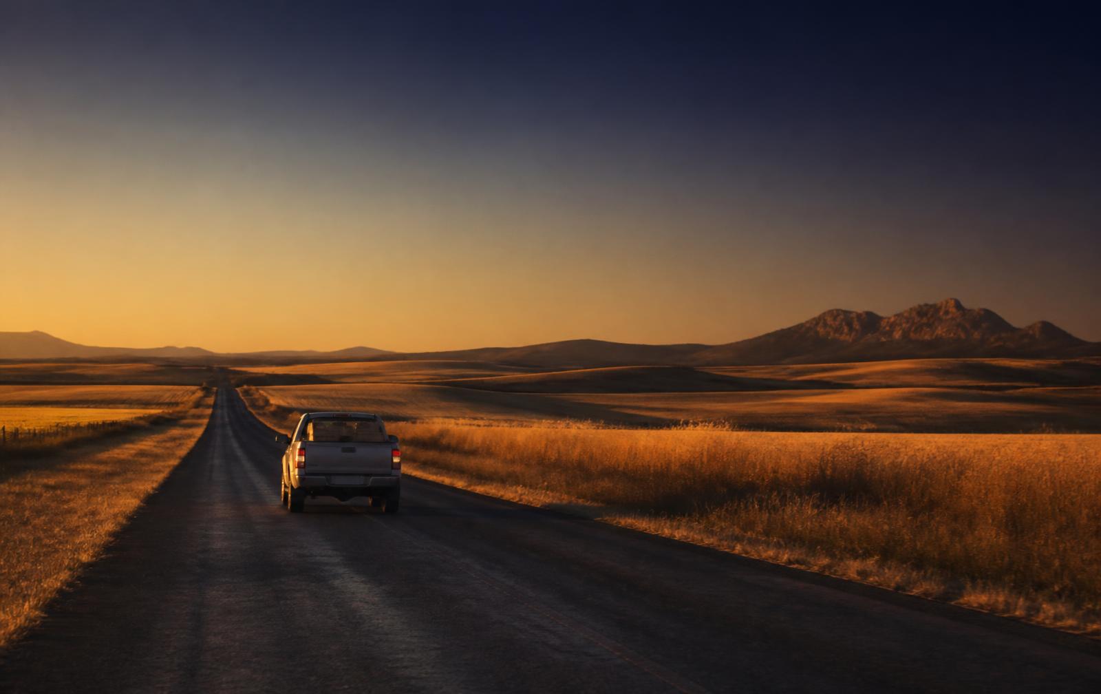 LBM courier vehicle on a rural Swartland road at dusk